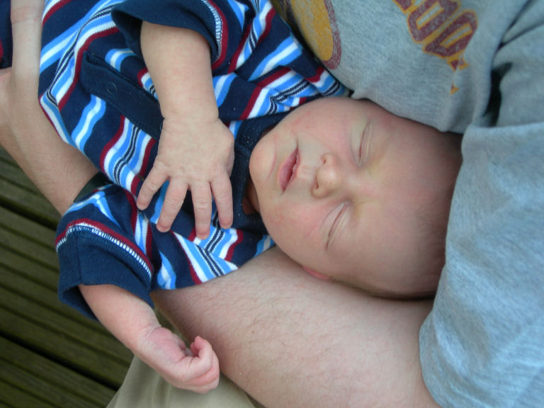 Alexander Frederick (Alex) (at 8 days) in the arms of his godfather, Rob Curtis